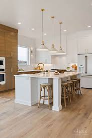 Try adding fronts to your appliances that mimic your cabinetry. Design Trend 2019 White Kitchen Appliances Becki Owens