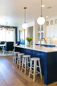 The gray barn livendale white kitchen island w/ storage. Blue And White Kitchen With Kitchen Island Stools And Kitchen Table With Chairs Hgtv