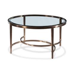 Glass tables make beautiful accent pieces, but they're also durable enough to be functional. Ritz Circular Coffee Table Brushed Antique Brass Finish On Stainless Steel Clear Glass Valuemark Furniture