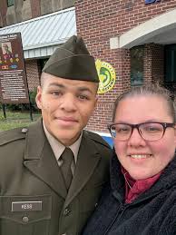 Proud family moment with sharp shooter medal