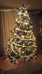 Christmas Tree Decorated With Only Ribbon And Hand Tied Bows Glitter Got Everywhere Tree Decorations Holiday Decor Christmas Tree