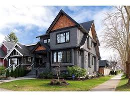 Depending on how dark you go, gray paint can exude elegance or make a strong statement. An Idea For The Exterior Dark Stucco And Painted Trim Contrasting With Warm Cedar Shake Gray House Exterior Exterior House Colors House Paint Exterior
