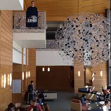Senior Sam Nute Displays The Unh Flag Inside The New Paul College Building On The Durham Nh Campus University Of New Hampshire Campus Home Decor