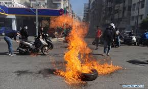 Elie, a firefighter, was killed at the beirut port blast in august 2020. Demonstrators Block Most Roads In Lebanon In Protests Against Massive Collapse Of National Currency Global Times