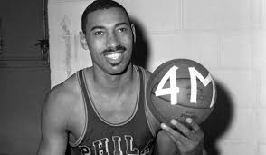 Wilt chamberlain, 7ft 2ins tall and 23 stone, was forced to play that role all his life. Wilt Chamberlain Biography And Facts