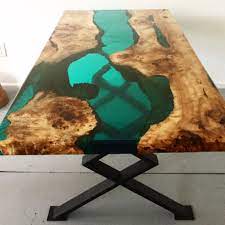 Mix another batch of epoxacast 690 and pour it over the table surface in a layer about 1/16 (0.16 cm) thick. Wood Resin Table Wood Resin Table Resin Table Wood Resin