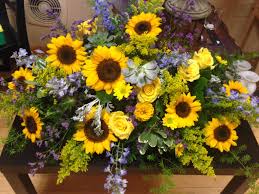 Flowers at a funeral are the final opportunity to express you sentiments and flora often. Sunflower Coffin Spray Floral Funeral Tribute Funeral Flowers Funeral Flower Arrangements Memorial Flowers
