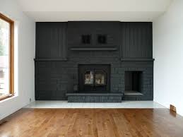 It was a classic brick fireplace, and it certainly wasn't horrible, especially once the walls were no longer dingy yellow. Charcoal Grey Painted Fireplace Grey Painted Fireplace Painted Brick Fireplaces Fireplace Remodel