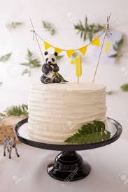 Share it with us in the comments below . Closeup Of Beautiful White Birthday Cake Celebration Treats Healthy Carrot Cake For 1 Year Old Baby Decorated With Toy Panda And Flags Banner And Fern Leaves Cure Idea Stock Photo Picture And