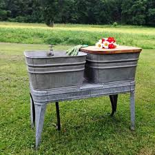 A rustic outdoor kitchen features an enormous stacked stone fireplace. Diy Outdoor Sink 11 Creative And Functional Garden Sink