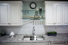 glass shelving above large, undermount