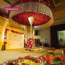 A Grand Stage Decorated With A Canopy Of Flowers Wedmantra Weddinginindia Indian Wedding Decorations Wedding Venue Decorations Indian Wedding Flowers