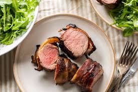 Wrap the tenderloin in bacon and drizzle it with a delicious sauce of chutney (or jam) and dijon mustard. Grilled Bacon Wrapped Pork Tenderloin Recipe