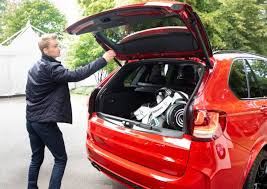 The trunks won't open if the battery went dead with the alarm set because arming the alarm physically locks the releases. The Bmw Courtesy Car Service The Bmw International Open Business Card To The Bmw International Open