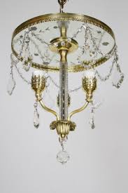 If it's hung above a surface, like a tabletop, give the surface and chandelier at least 30 to 32 inches of separation. Three Light Flush Brass And Crystal Chandelier Appleton Antique Lighting