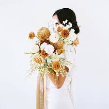 We've gathered rustic 29 fall wedding bouquets that are so gorgeous, you'll wish they could last forever. Caramel Colored Blooms Coming Together In This Fall Bridal Bouquet Colorful Orange Dahlias And W Modern Wedding Bouquets Wedding Bouquets Fall Wedding Flowers