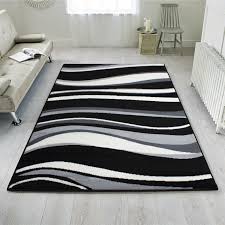 Adding a rug to your living room can completely transform the area, adding warmth and a softness as well as high end style. Black Grey Waves Modern Living Room Rug Milan Kukoon Rugs Official Online Store