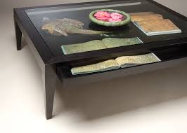 With a minimalist look and extensive decorating possibilities, a glass coffee table set unifies a room while enhancing the aesthetic appeal of the space. Contemporary Style Glass Top Coffee Table Gregory Hay Designs