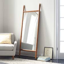 Not dented, and no color loss. Mid Century Dowel Mirror Pecan