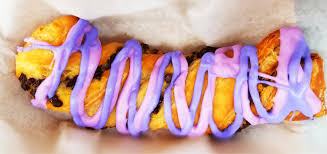 This snack stand sells beverages, including slushys, and treats such as the iconic cheshire cat tail. Tasty Treat Tuesday Cheshire Cat Tail Mickeyblog Com