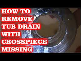 Simple plumbing snakes can be bought online for only a few dollars. How To Remove Tub Drain W Broken Cross Members Youtube