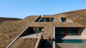 The sloping block building process. Mold Architects Used Advantages Of Sloping Land To Design Ncaved House In Greece