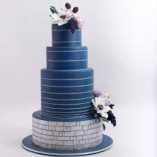 The Top 10 Wedding Cake Trends Of 2018 Include Deep Denim Blue Cakes Romantic Botanical Printed Cakes Delicate Swag Cak Sparkle Cake Violet Cakes Floral Cake