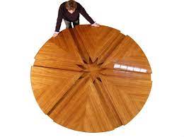 Restoration hardware branches into the modern realm. The Expandable Fletcher Capstan Table