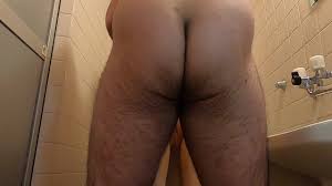 A bristle Japanese man stands back with a large onaho in the bathroom and  finally ejaculates toward