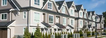 A townhouse typically has a unique front and back entrance, is multiple stories, and has one or two communal walls. What Are The Pros And Cons Of Living In A Townhouse