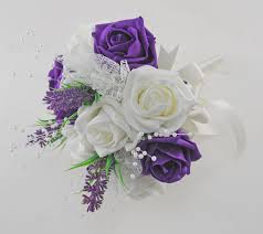 A classic compact wedding bouquet of white roses gets the glam treatment with a collar of black feathers. Bridesmaids Purple Ivory Rose Wedding Bouquet With Lavender Lace Budget Wedding Flowers