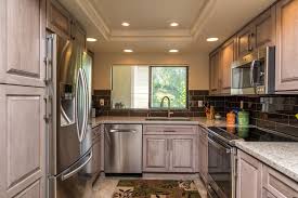 A Kitchen Remodel In San Diego California Features Starmark Cabinetry S Ridgeville Door Style In Cherry In A Cu Grey Kitchens Kitchen Remodel Custom Kitchens