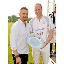 tom hardy presents prince william duke of cambridge with a trophy on behalf of team audi ultra during day one of the audi polo challenge at coworth park on ma