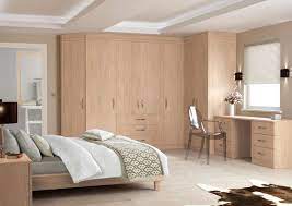 Idyllic Fitted Bedroom Design With Brown Grains Wood Four Door Three Center Drawers Wardrobe Also Brown Fitted Bedrooms Bedroom Design Fitted Bedroom Furniture