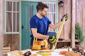 Maybe you would like to learn more about one of these? Side View Of Concentrated Carpenter Taking Measures Of Wooden Plank On Porch Free Stock Photo And Image