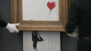 Banksy trolled the art world, and the internet is running with it. Shredded Banksy Million Dollar Painting Goes On Display In Germany Abc7 Chicago