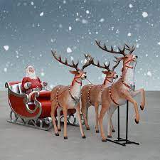 Santa can't fly without his sleigh and team of magical reindeer. Jumbo Sleigh Santa Three Reindeer Decor Set Display 132 In