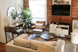 A 425 Square Foot Rental Does A Good Job Of Not Feeling Like The Studio Apartment It Is Apartment Living Studio Apartment Living Room Photos