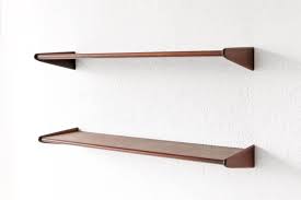 A row of wall hooks or a minimalist floating shelf near the door lets you keep your coat and bag within reach as you head out for work. Pair Of Danish Modern Walnut Floating Shelves 1stdibs Com Walnut Floating Shelves Antique Shelves Shelves