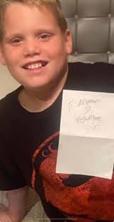 Z-Ro Signing a Picture for a Young Fan at a 2020 Show