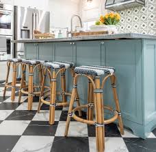 A light blue hue brings in color. How The Sophisticated Details Make This French Bistro Inspired Kitchen Shine