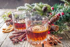 Make one of the brown liqueur cocktails and your friends will be begging you to become their live in bartender. Christmas Winter Alcohol Drink Orange Spice And Bourbon Whiskey Alcoholic Cocktail In Two Glasses Wooden Background With Christmas Tree Branches And Decor Copy Space Stock Photo Picture And Royalty Free Image Image