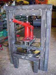 Homemade hydraulic press fabricated from steel and powered by a bottle jack. Homemade Hydraulic Press Metal Bending Tools Homemade Tools Metal Working Tools