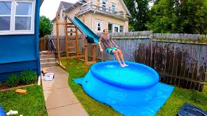 Outdoor garden above ground swimming pools designs via. How To Set Up A Swimming Pool With Water Slide Youtube