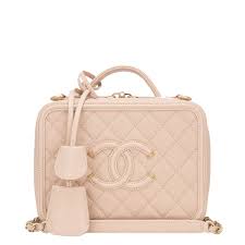 Chanel small filigree vanity case of light beige caviar leather with gold tone hardware. Chanel Light Beige Caviar Small Filigree Vanity Case Dop