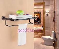 Bathroom towel rack rotating towel holder wall mounted hanger stainless steel swivel rack bar bathroom shelf rail 2021 hot. Oil Rubbed Bronze Bathroom Shelf W Towel Rack Hotel Style Towel Bar Wall Rack 119 Towel Rack Bathroom Shelves Oil Rubbed Bronze Bathroom