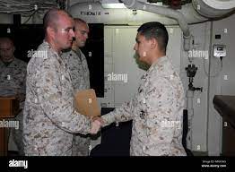 MEDITERRANEAN SEA (March 16, 2018) U.S. Marine Corps Lance Cpl. Joseph Ortiz  assigned to Battalion Landing Team, 2nd Battalion, 6th Marine Regiment,  26th Marine Expeditionary Unit (MEU) receives a certificate of completion