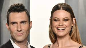 The frontman is sporting a beard and shaved head as he hangs out and smokes a joint in what looks like a backyard. The Real Reason Adam Levine And Behati Prinsloo Got Back Together