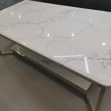 Quartz is an engineered stone made from ground quartz, resins, polymers and pigments. Calacatta Quartz Table Tops Calacatta Quartz Quartz Stone Countertops Table Tops