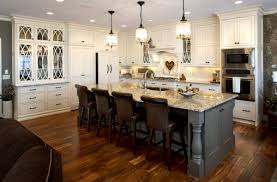 Use a brush to cut in the corners and edges, then a small roller to create a uniform finish. See This Kitchen S Graceful Glass Doors Showplace Cabinetry